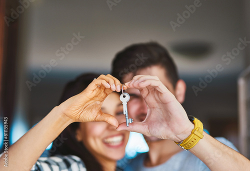 New house, heart in hands and couple with keys for property, moving day and home investment. Homeowner, real estate and happy man and woman with keychain for mortgage, purchase and rental apartment