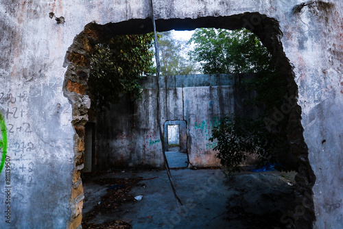 The wall of an abandoned building has become a place for murals.