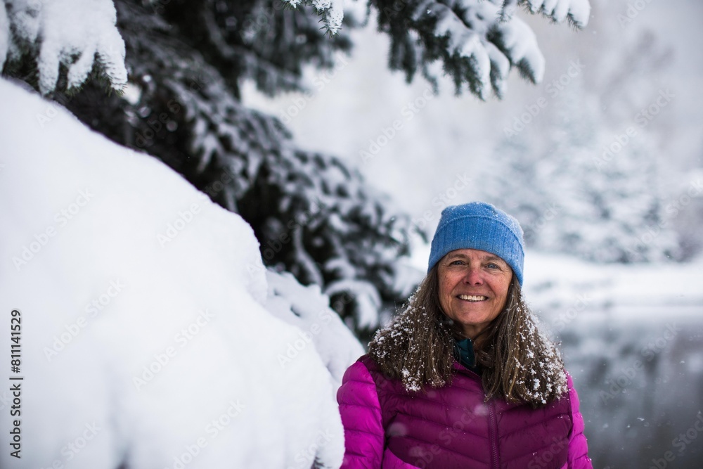 A portrait of a very happy middle aged woman on cold wintery day in Colorado, USA A portrait of a very happy middle aged woman on cold wintery day in Colorado, USA