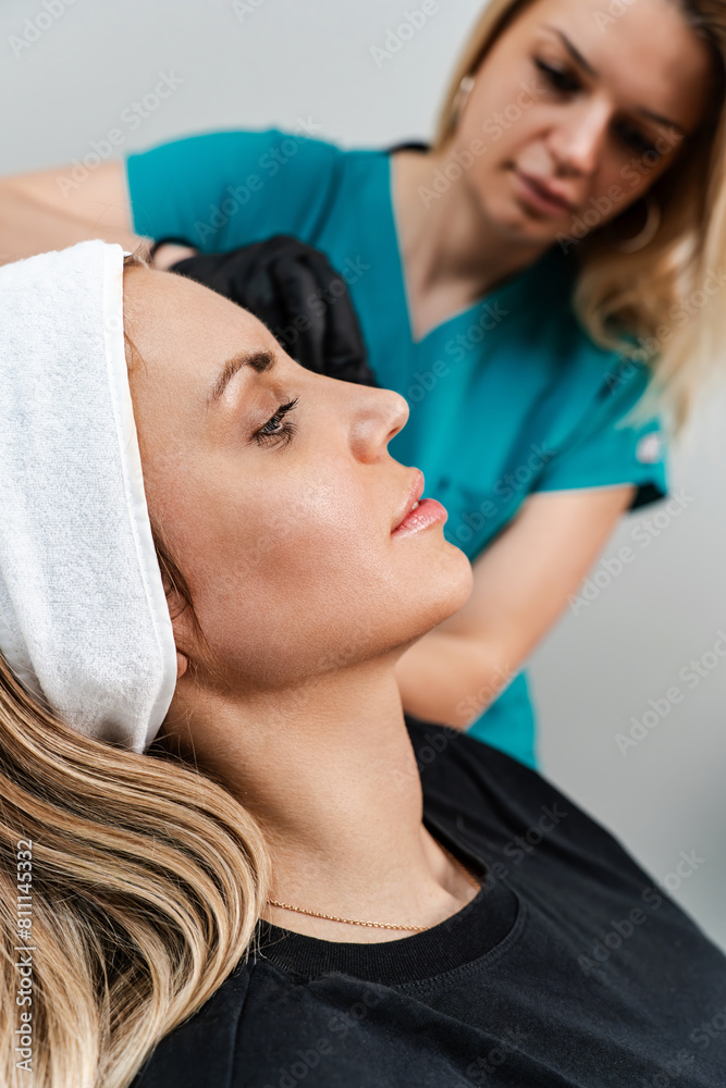 Beautiful brunette woman patient preparing for medical and beauty treatment with botulinum toxin injections or hyaluronic acid fillers. Beautiful brunette woman patient preparing for medical and beauty treatment with botulinum toxin injections or hyaluronic acid fillers.