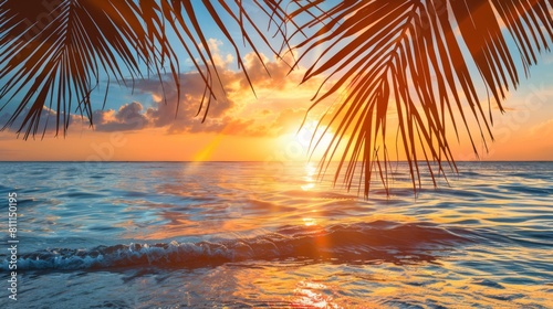 Summer background with tropical sunset overlooking the ocean with palm leaves. The atmosphere is magical  embodying the tranquil  dreamy allure of a tropical paradise