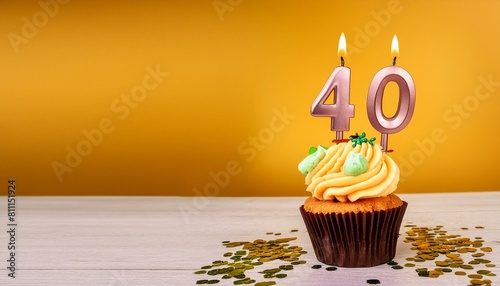 Birthday cupcake with burning lit candle with number 40. Number thirtynine for thirtynine  photo