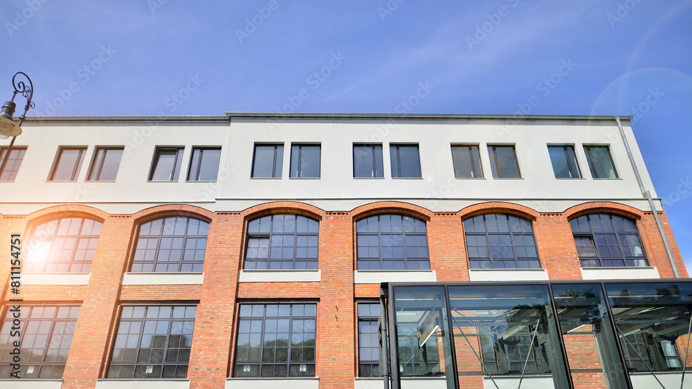 Modern office building with white metallic panel facade and windows. Modern architectural details. Modern office building with white metallic panel facade and windows. Modern architectural details.