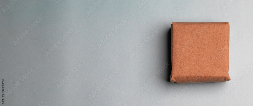 Fototapeta premium Gift box kept on a flat lay blue background