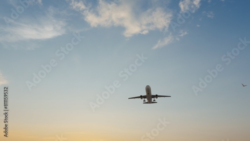 Airplane in the sky at sunset. Air transportation. Travel. Airplane Takes Off Against the Background of Blue Sky. 