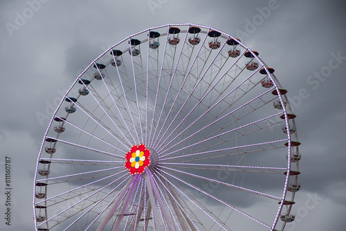 Ferris wheel with colored lights on the Prater in Vienna. dark clouds in the background © SusaZoom