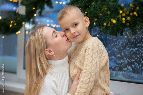 Mom and son in the interior of the Christmas room.