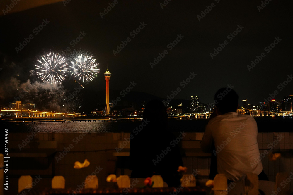 Naklejka premium Romantic Couples under Macau Fireworks