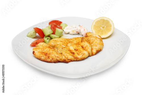 chicken fillet wuth salad and lemon on dish