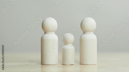 Wooden figures on white background. teamwork, leadership and business team creative thinking