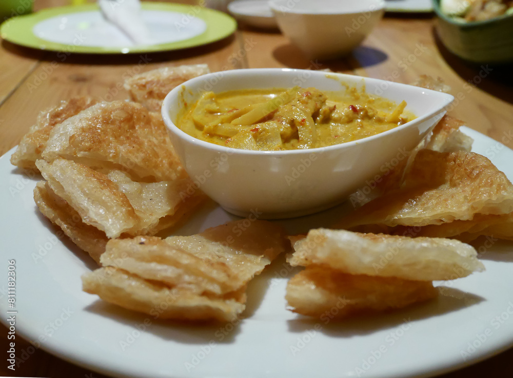 Indian pancake served with chicken curry
Indian pancake served with chicken curry