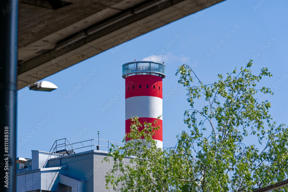 Looking up concrete red and white striped concrete chimney of district heating at Swiss City of Zürich on a sunny spring noon. Photo taken May 10th, 2024, Zurich, Switzerland. Looking up concrete red and white striped concrete chimney of district heating at Swiss City of Zürich on a sunny spring noon. Photo taken May 10th, 2024, Zurich, Switzerland.
