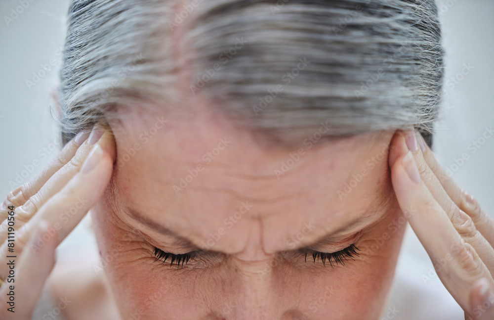 Fototapeta premium Headache, closeup and mature woman with fatigue and burnout from stress in office and business. Frustrated, person and migraine with brain fog in workplace and health crisis from anxiety or worry