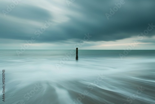 A black and white view of powerful waves crashing onto the shore with a dramatic contrast, A frame that uses negative space to create a sense of balance