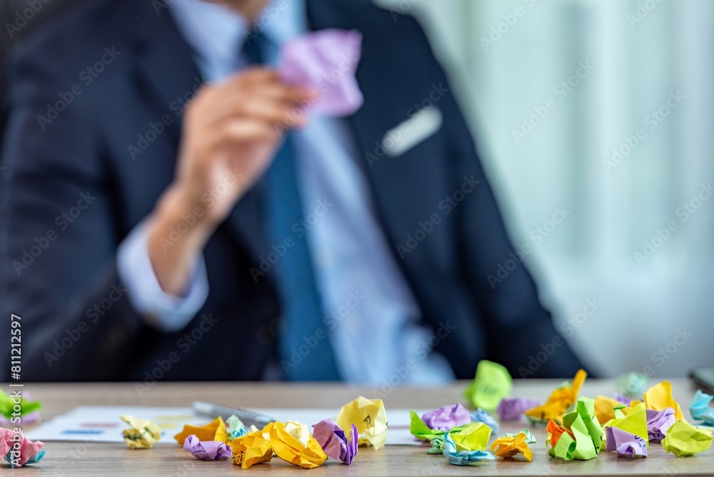crumpled colorful paper balls on desk crumpled colorful paper balls on desk
