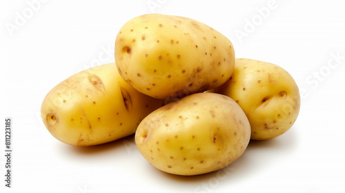 a close up of a pile of potatoes on a white surface