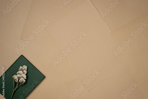 Sheets of paper background with flower on a notebook. Vintage. Copy space