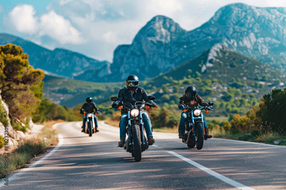 Group of motorcycle riders in black clothes on the road Group of motorcycle riders in black clothes on the road