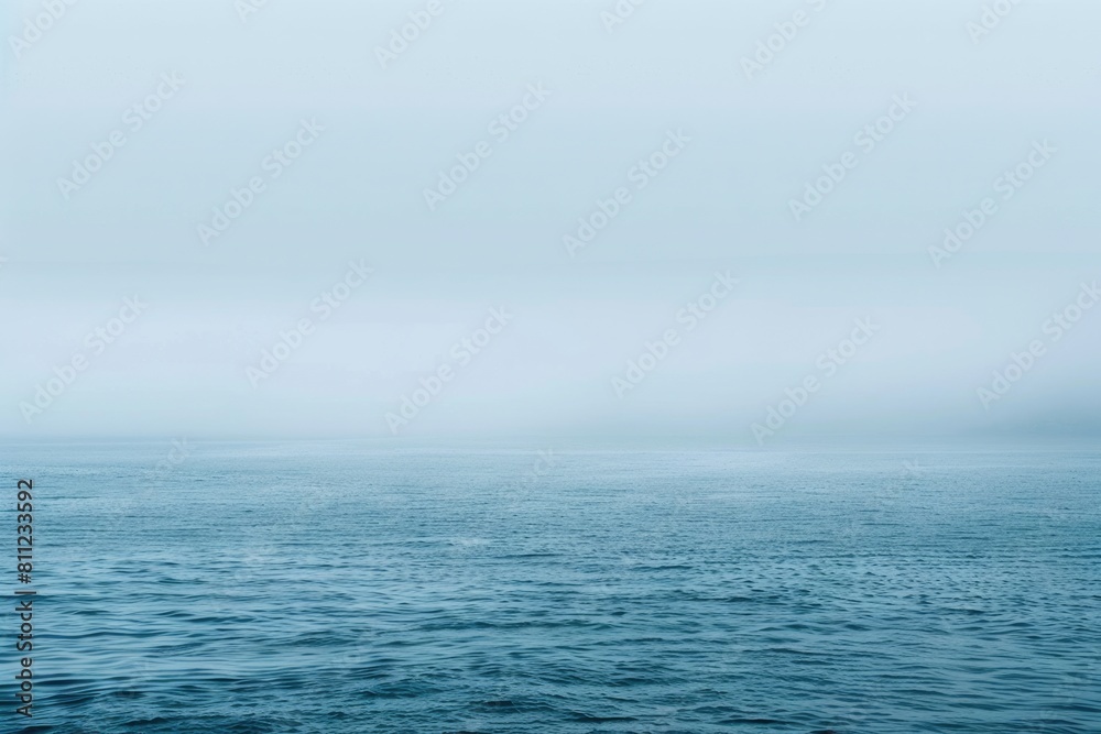 Fototapeta premium Tranquil Blue Sea Landscape with Foggy Background. Perfect Image for Nature Lovers and Ocean