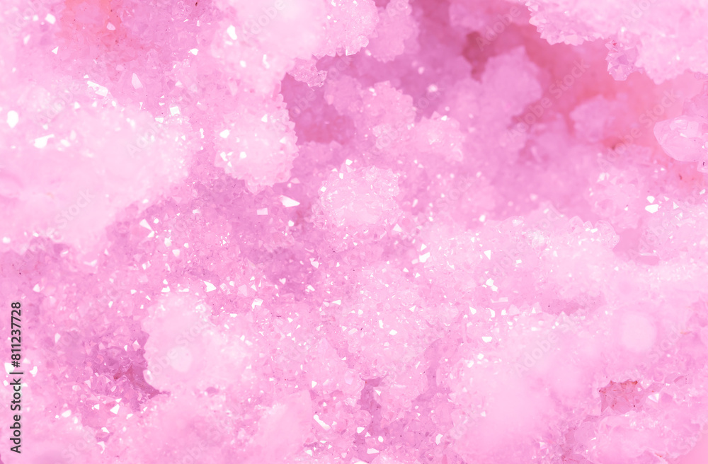 Amethyst pink crystals. Gems. Mineral crystals in the natural environment. Texture of precious and semiprecious stones. Seamless background with copy space colored shiny surface of precious stones. Amethyst pink crystals. Gems. Mineral crystals in the natural environment. Texture of precious and semiprecious stones. Seamless background with copy space colored shiny surface of precious stones.