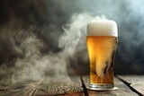 Glass of beer on a wooden table with smoke in the background