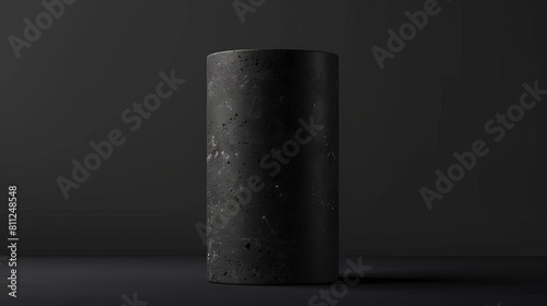 Sleek black stone pedestal standing on a dark background, perfect for a refined and high-contrast product presentation