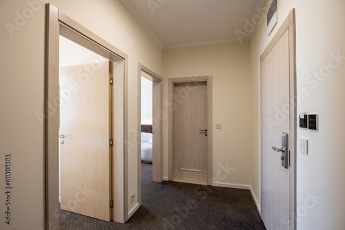 Interior of a carpeted hotel corridor doorway