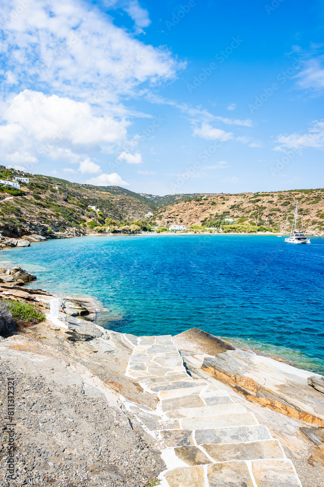Steps to beach and view of azure sea bay near Chrysopigi monastery, Sifnos island, Greece Steps to beach and view of azure sea bay near Chrysopigi monastery, Sifnos island, Greece
