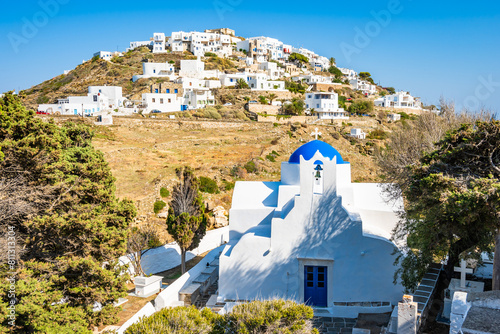 View of church monastery with blue dome in mountain landscape near Kastro village, Sifnos island, Greece