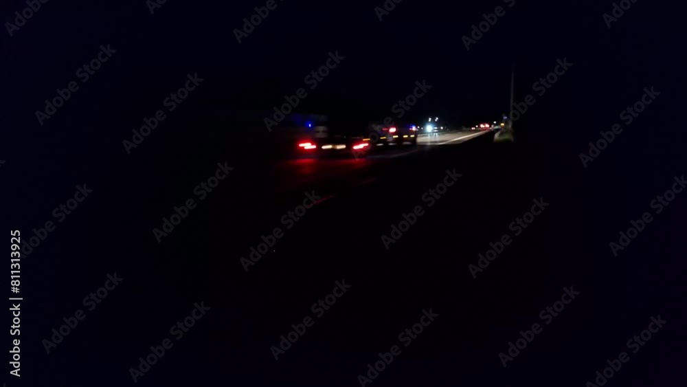 Timelapse of night traffic on the freeway. Timelapse of a stream of cars on a night time motorway. The concept of cargo transport and globalization Timelapse of night traffic on the freeway. Timelapse of a stream of cars on a night time motorway. The concept of cargo transport and globalization