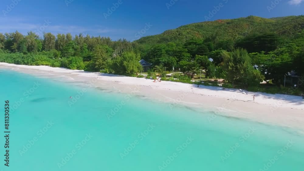 Praslin Beach, Seychelles. Aerial view of tropical coastline on a sunny day Praslin Beach, Seychelles. Aerial view of tropical coastline on a sunny day