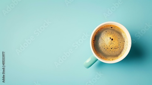 Freshly brewed coffee in a blue cup on a blue background. photo