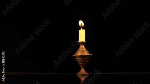 burning candle in the dark