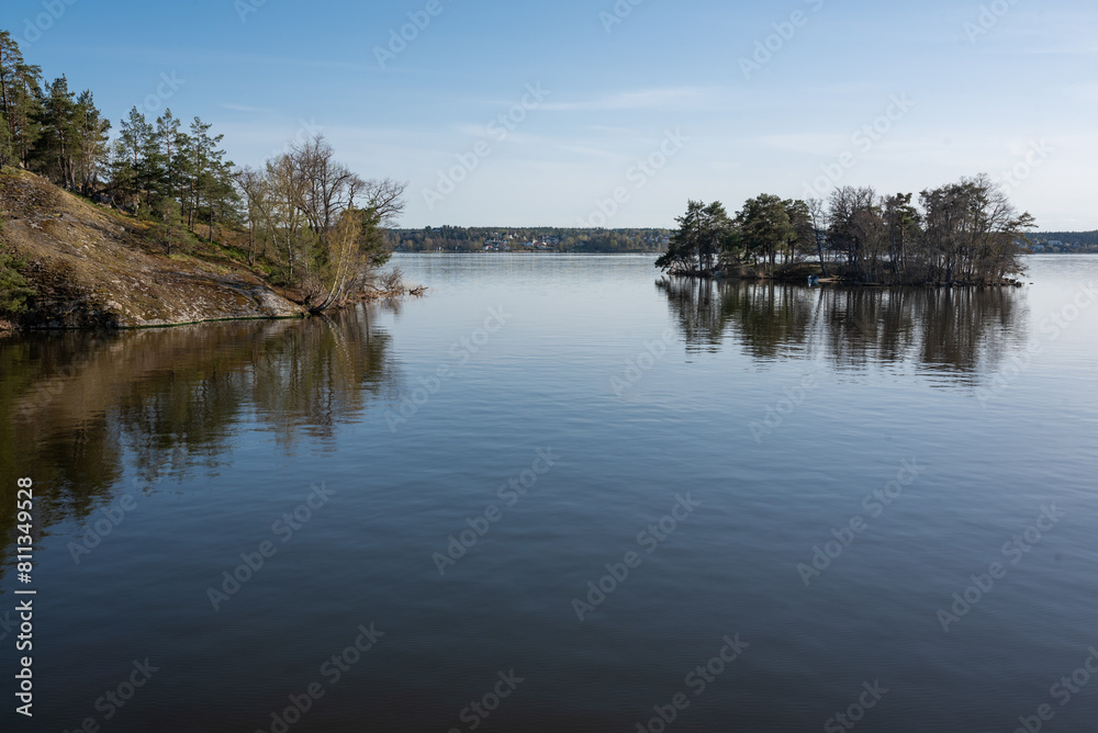 Concept of lonely island landscape: Kaninholmen - Swedish island,  lonely island surrounded by water, beautiful place on sunny evening