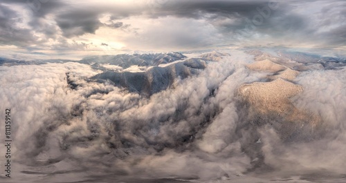 Severe frost at sunrise in the Carpathians  Transcarpathia  Ukraine. A drone flies over the tops of mountains shrouded in picturesque fog from river valleys