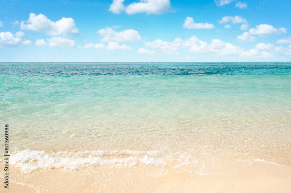 Peaceful topical seascape background with blue sky and white clouds. Copy space