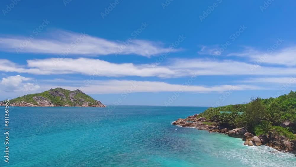 Grand Sister Island close to La Digue, Seychelles. Aerial view of tropical coastline on a sunny day Grand Sister Island close to La Digue, Seychelles. Aerial view of tropical coastline on a sunny day