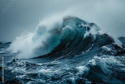 Ocean wave crashing fiercely amid cloudy weather