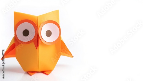 Animal concept origami isolated on white background of a cute and adorable owl with big eyes, with copy space side, simple starter craft for kids