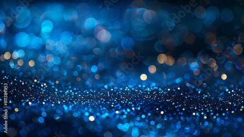 Abstract blue bokeh lights background in the style of glitter and sparkle effect on dark night banner Design for celebration, wedding or new year party concept