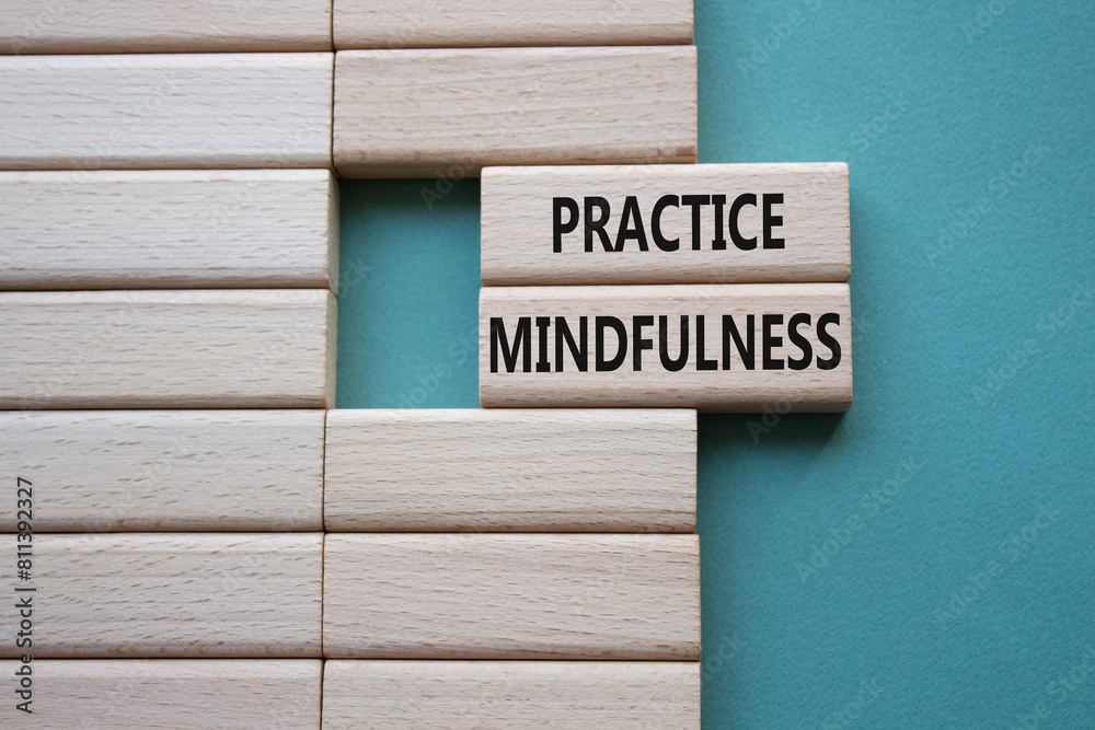 Practice Mindfulness symbol. Concept words Practice Mindfulness on wooden blocks. Beautiful grey green background. Medical and Psychology and Practice Mindfulness concept. Copy space. Practice Mindfulness symbol. Concept words Practice Mindfulness on wooden blocks. Beautiful grey green background. Medical and Psychology and Practice Mindfulness concept. Copy space.