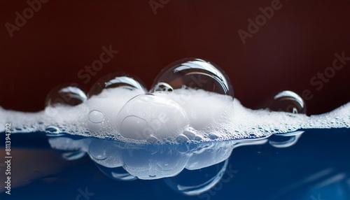 blue water with white foam bubbles foam water soap suds foam bubbles texture foam close up blue soap bubbles background photo
