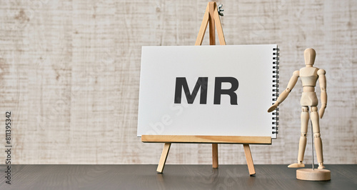 There is notebook with the word MR. It is an abbreviation for Medical Representatives as eye-catching image. photo