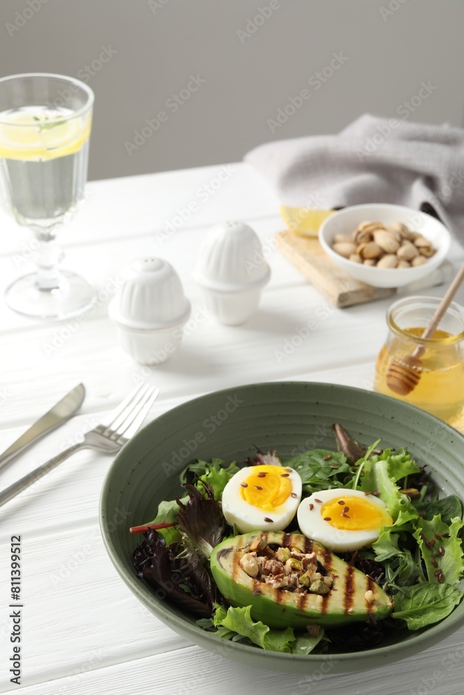 Healthy dish high in vegetable fats on white wooden table Healthy dish high in vegetable fats on white wooden table