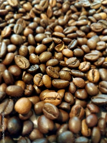 A closeup of coffee beans, showcasing their rich color and texture.
