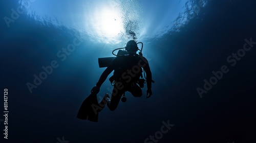 A scuba diver is checking a healthy coral reef in a tropical sea