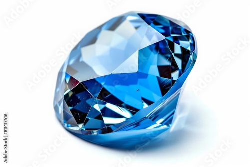 Closeup of a single blue crystal gemstone with multifaceted surfaces, creating stunning reflections, isolated against white