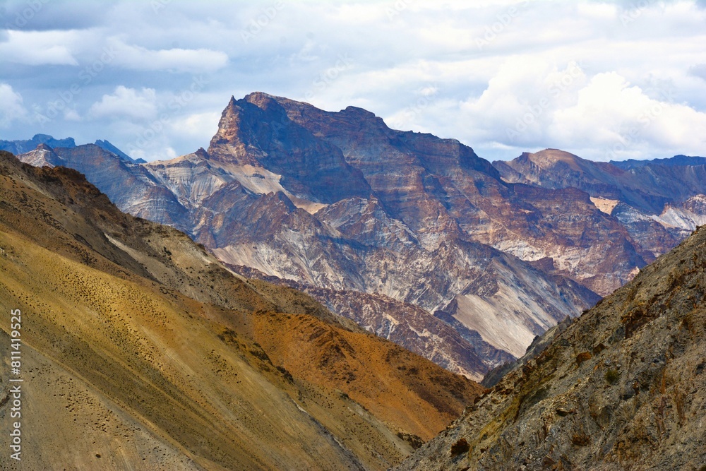 View of picturesque mountain landscape as seen from the hiking trail crossing the Ganda La pass (4980 m) and leading to Markha valley (Hemis National Park, Ladakh, India)