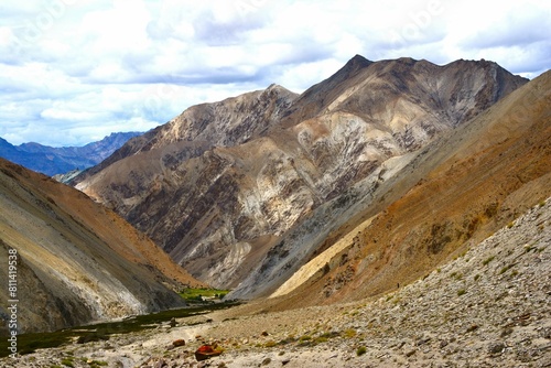 View of picturesque mountain landscape as seen from the hiking trail crossing the Ganda La pass (4980 m) and leading to Markha valley (Hemis National Park, Ladakh, India)
