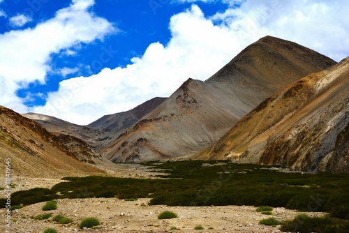 View of picturesque mountain landscape as seen from the hiking trail crossing the Ganda La pass (4980 m) and leading to Markha valley (Hemis National Park, Ladakh, India) photo